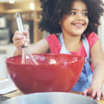 child helps baking