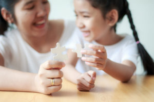 mother playing with daughter