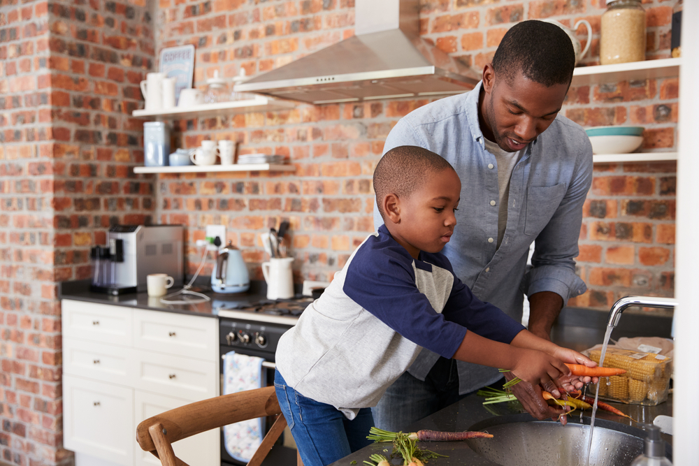 child helping with meal preparation