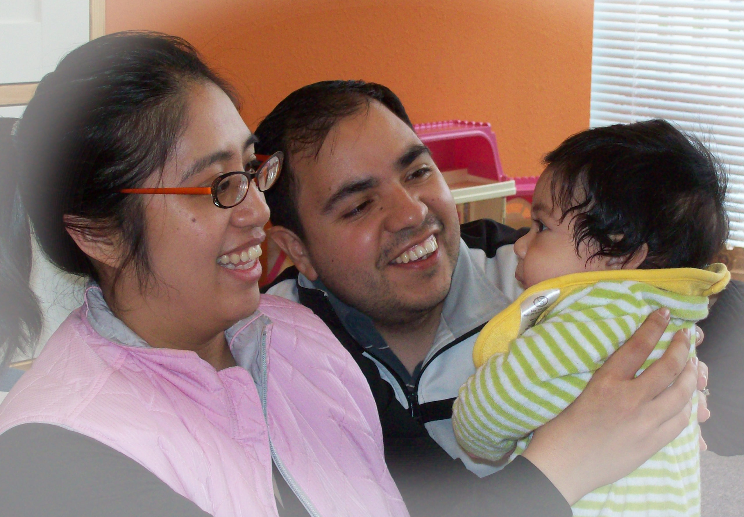 Mom, Dad and toddler together